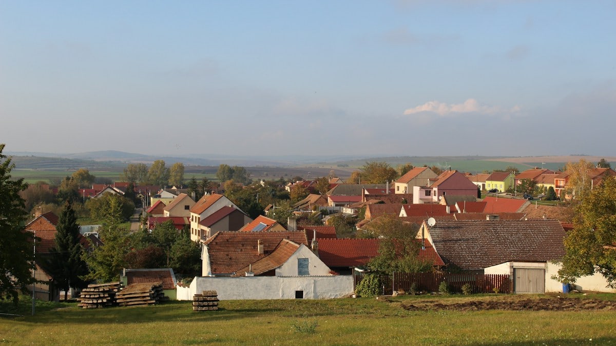 brown and white houses under white sky during daytime